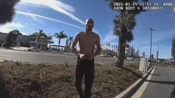 Police bodycam image of shirtless man walking up